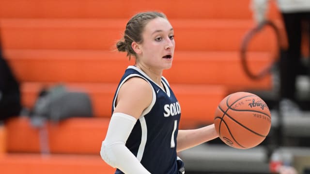 Mackenzie Blackford of Solon brings the ball up the floor
